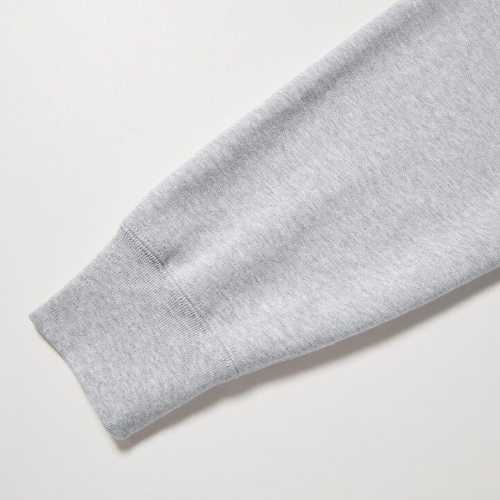 svart uniqlo herrmönstrad sweatshirt med dragkedja