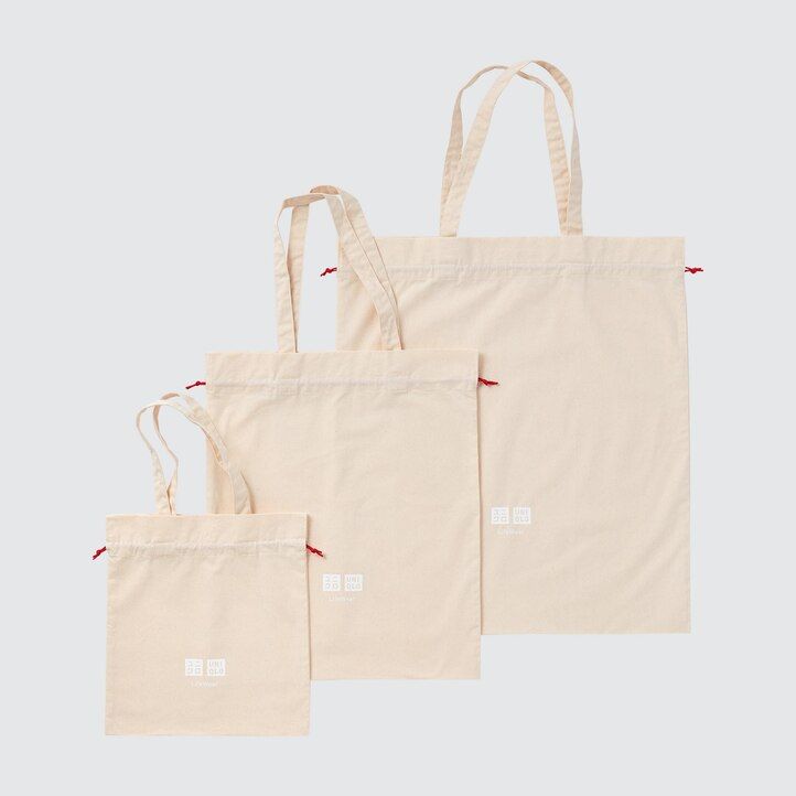 vit uniqlo presentpåse återanvändbar tygkasse damväskor
