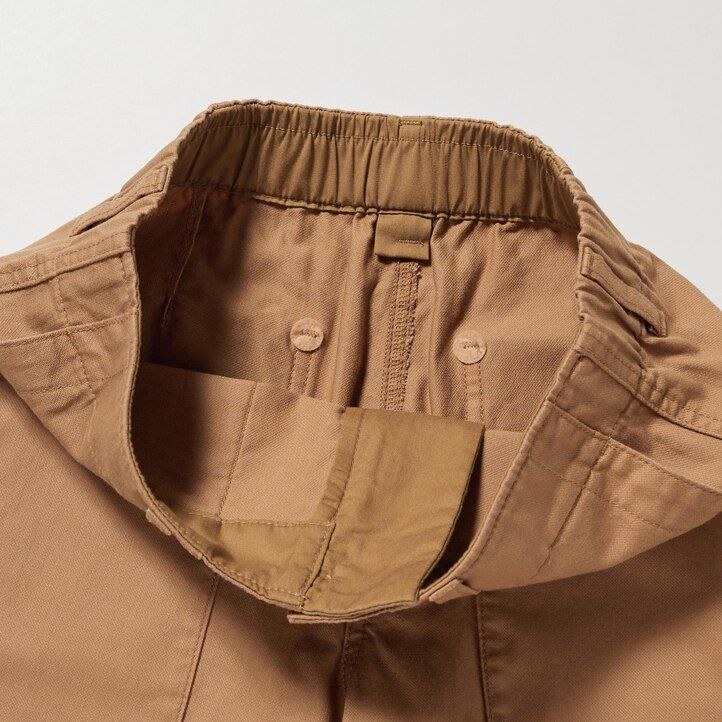 vita uniqlo toppar med vida ben för kvinnor